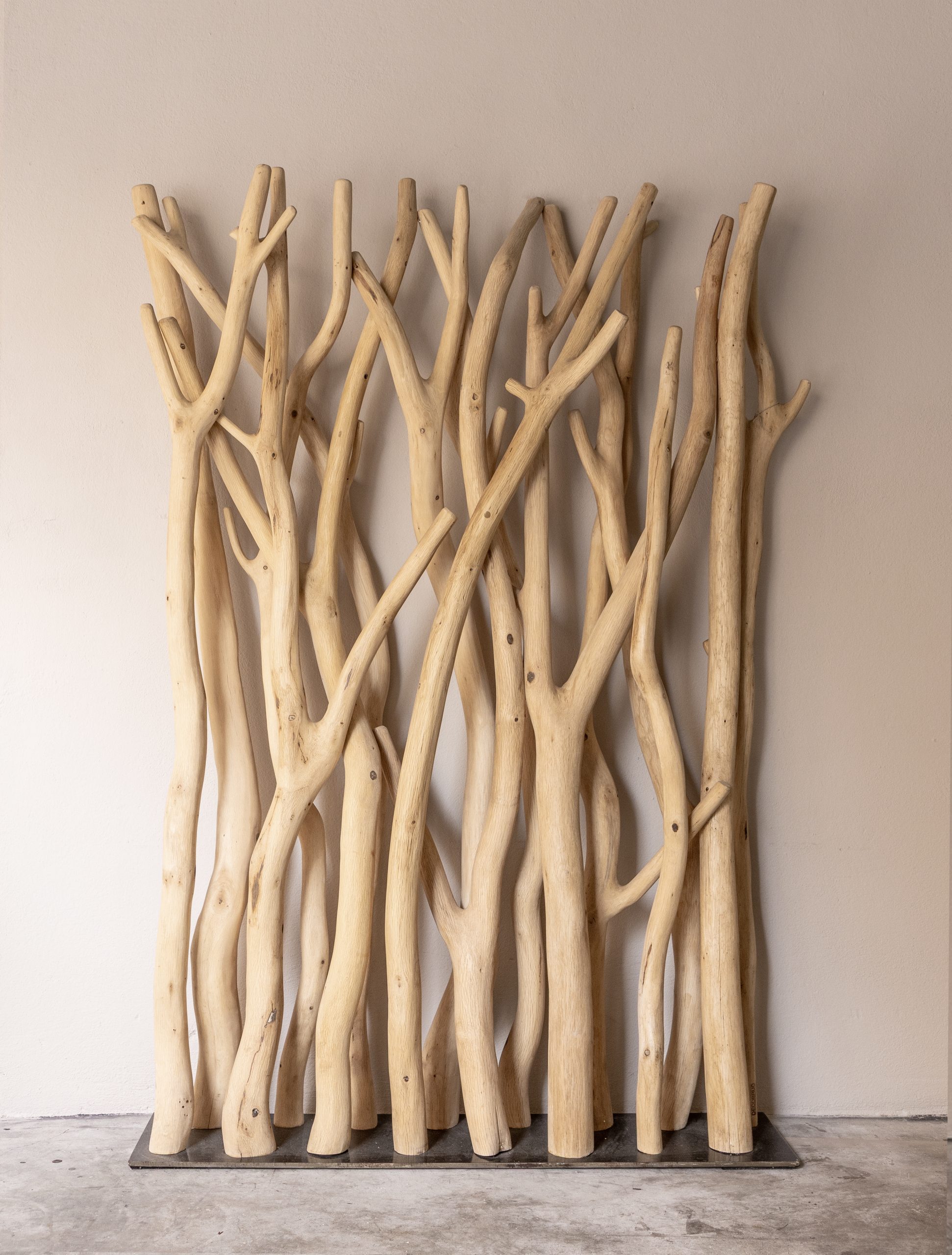 biombo roure Separador d’ambient amb branques naturals.